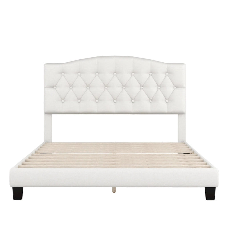Cama de plataforma tapizada con cabecero curvado tipo silla de montar y detalles capitoné en forma de diamante