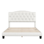 Cama de plataforma tapizada con cabecero curvado tipo silla de montar y detalles capitoné en forma de diamante