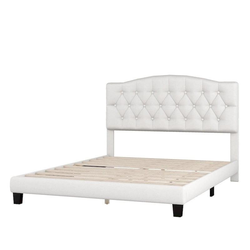 Cama de plataforma tapizada con cabecero curvado tipo silla de montar y detalles capitoné en forma de diamante